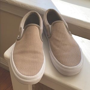 Tan colored Vans slip on sneakers